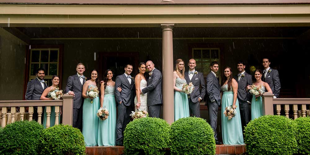 Elizabaethtown-Victorian-Wedding-party-porch-rain-1