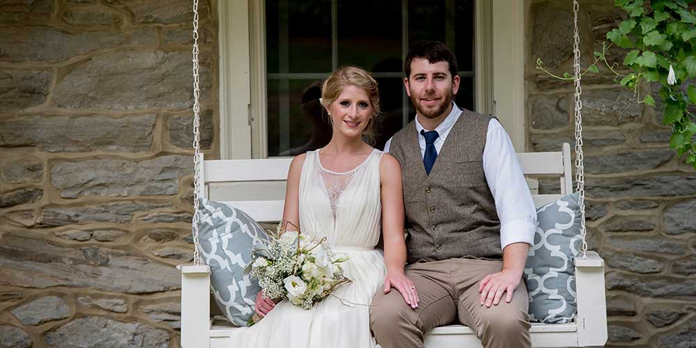 Lancaster Rustic Wedding couple porch swing